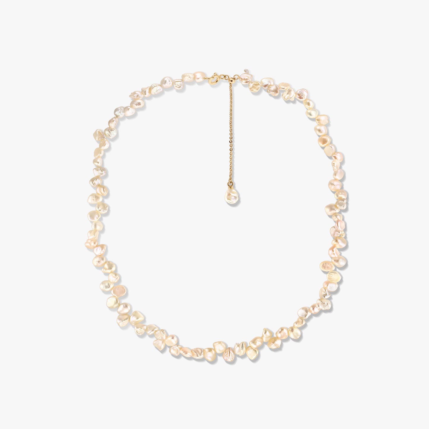 Gold‑plated silver necklace with irregular pink keshi pearls and an adjustable extender, photographed on a white background.
