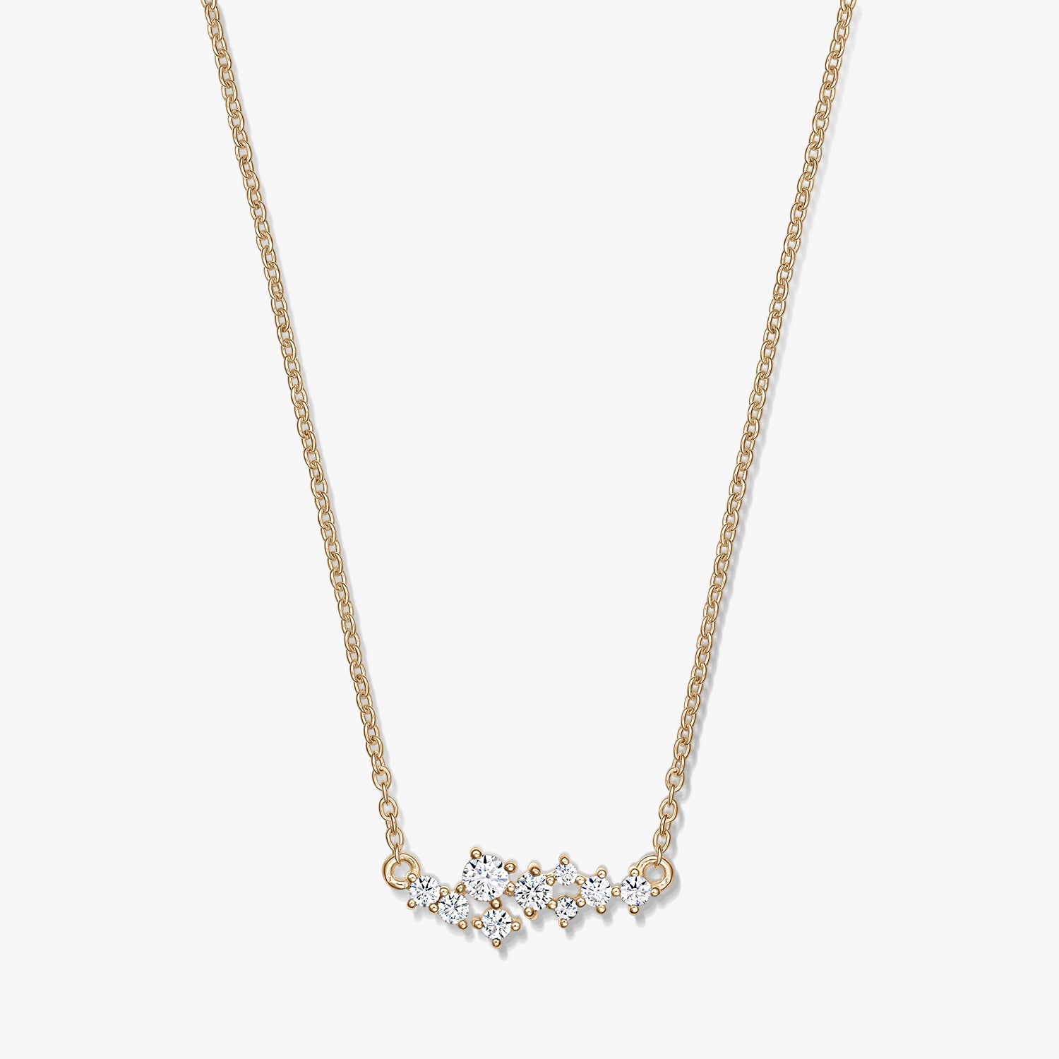 Golden Constellation silver necklace with a delicate chain and a starry cluster of clear stones, photographed on a white background.