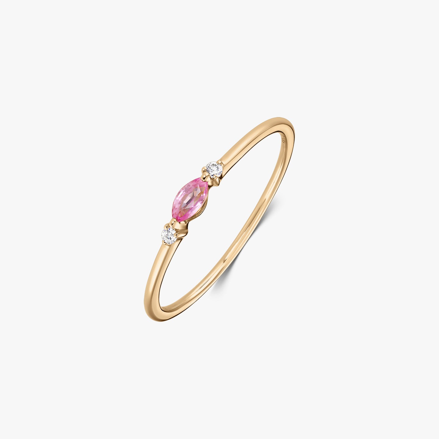 14k yellow gold ring with a marquise-cut pink sapphire centered between two small round natural diamonds on a white background.