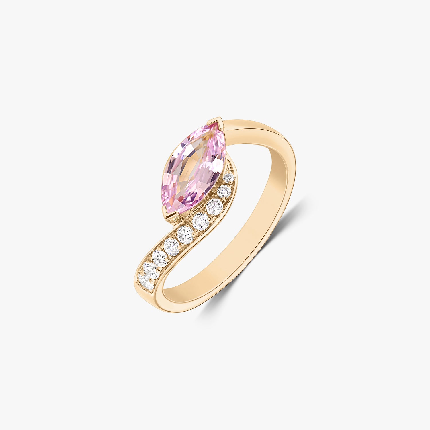 14K yellow gold bypass ring with a marquise‑cut pink sapphire and a row of natural diamonds, isolated on a white background.