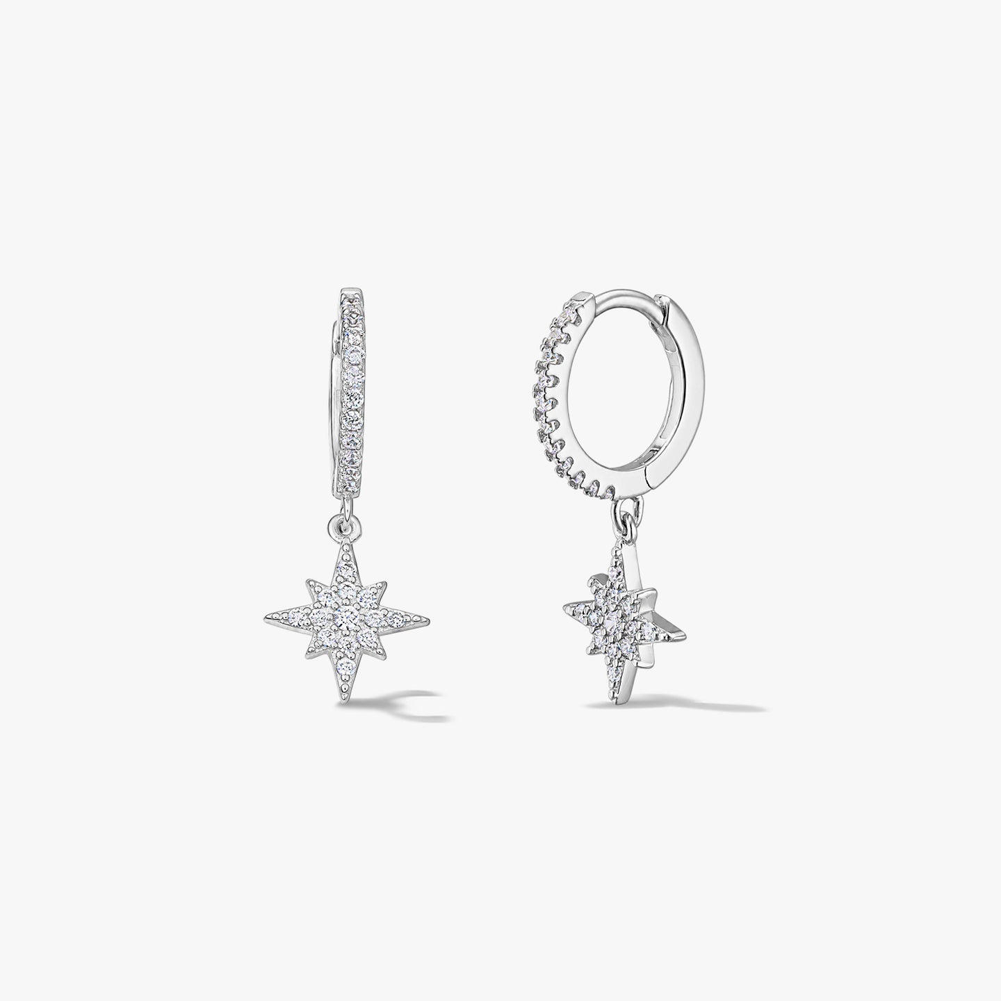 Pair of sterling silver hoop earrings with North Star pavé zirconia charms on a white background.