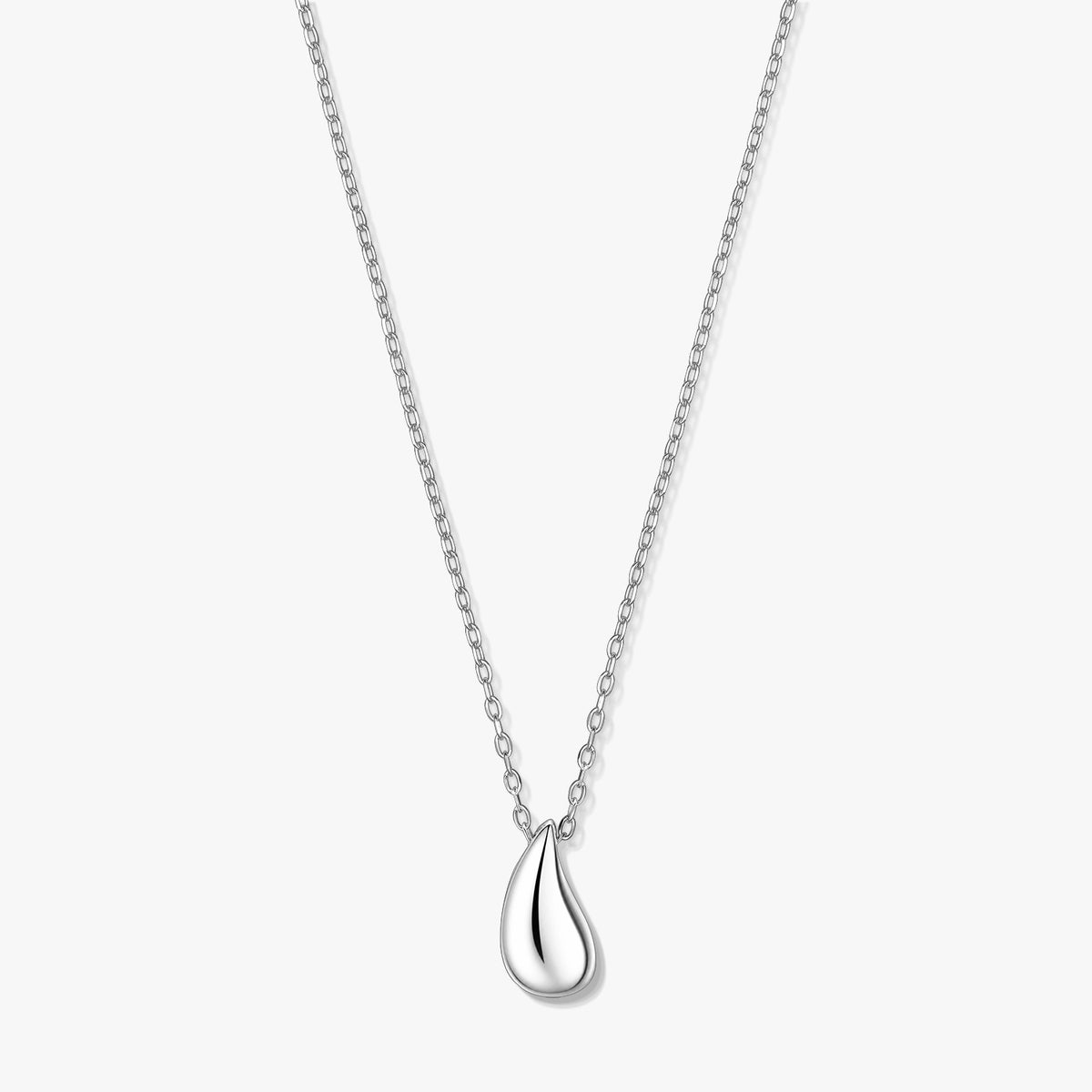 Silver teardrop pendant necklace on a fine chain, photographed on a white background.