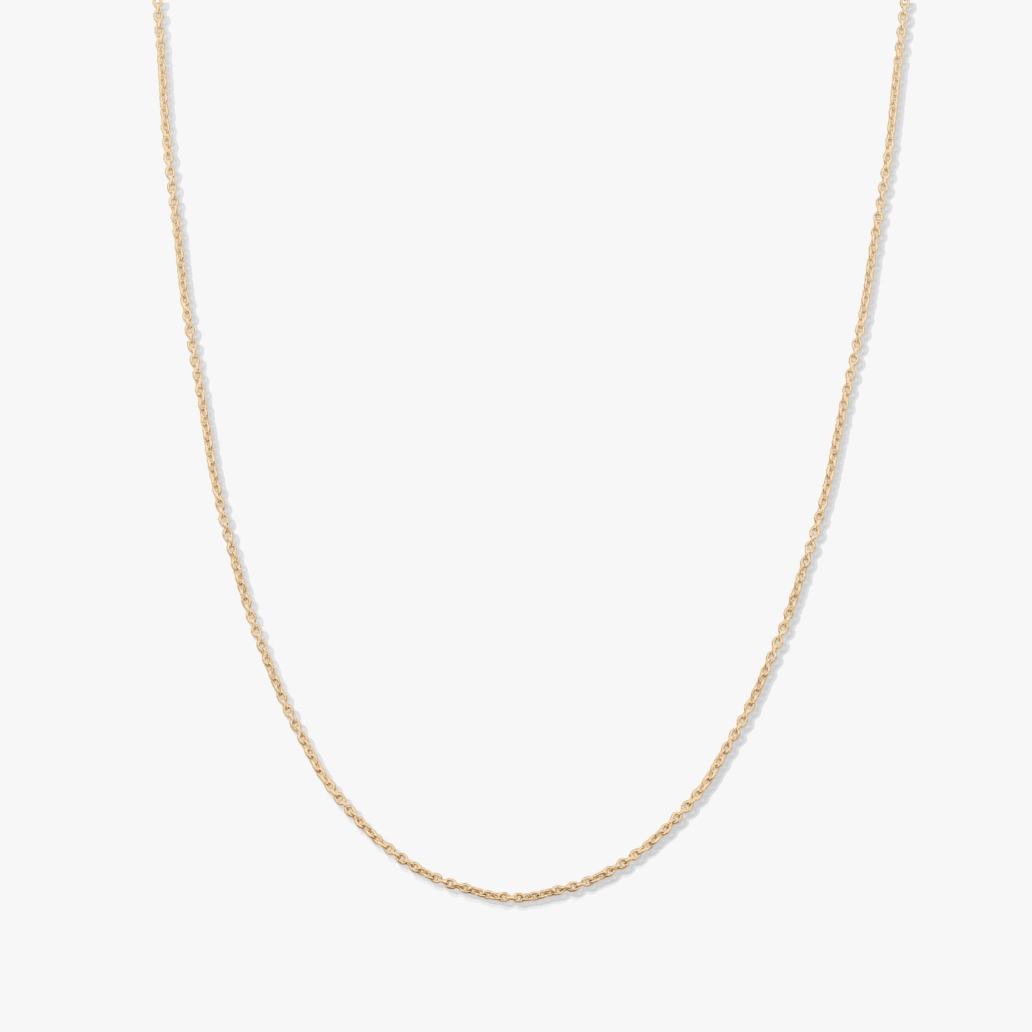Minimal 14K yellow gold chain necklace photographed on a solid white background.