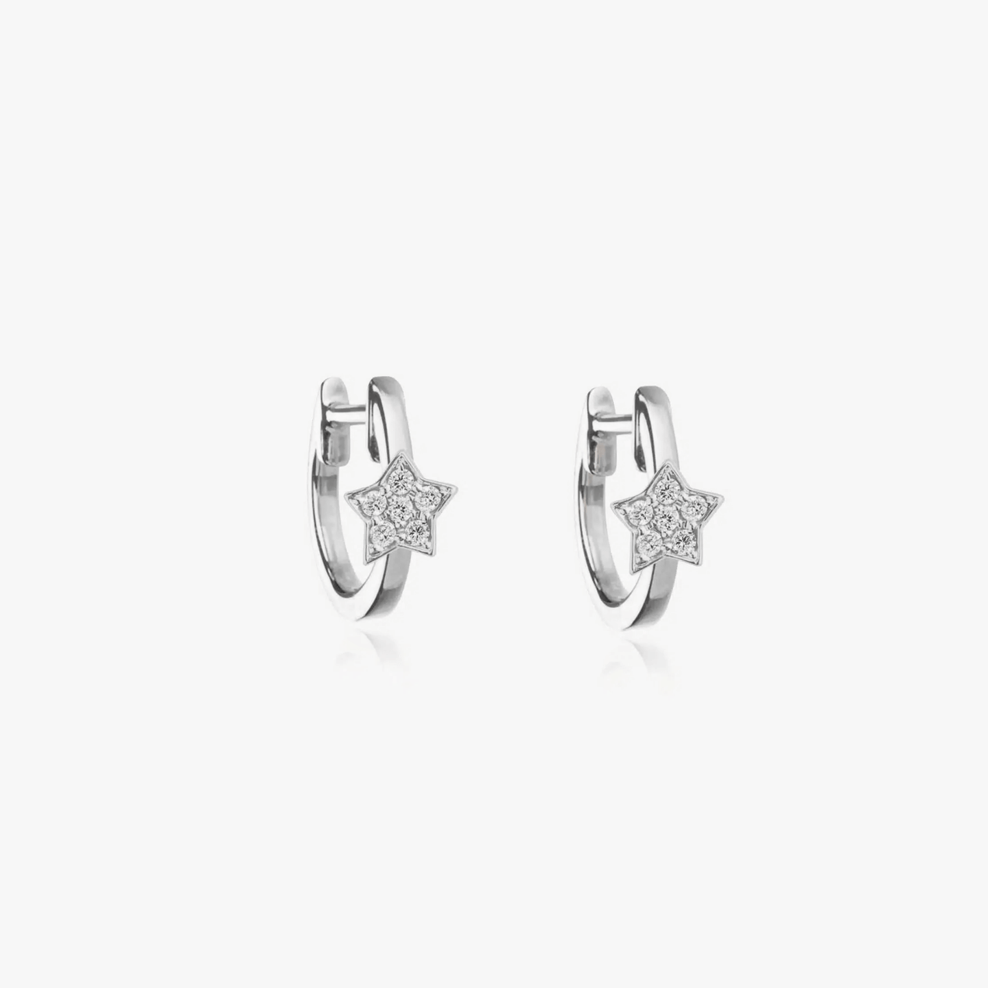Silver hoop earrings with star-shaped zirconia detailing on a white background.