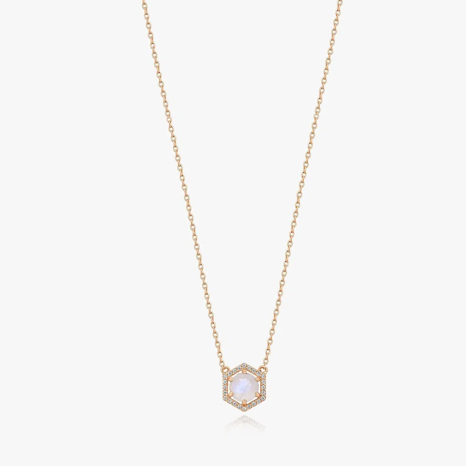 Rose silver necklace with moonstone pendant on a solid white background.