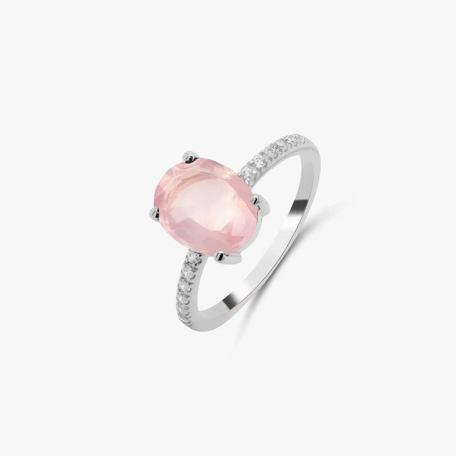 Silver ring with a rose quartz stone and small zirconia stones set on a white background.