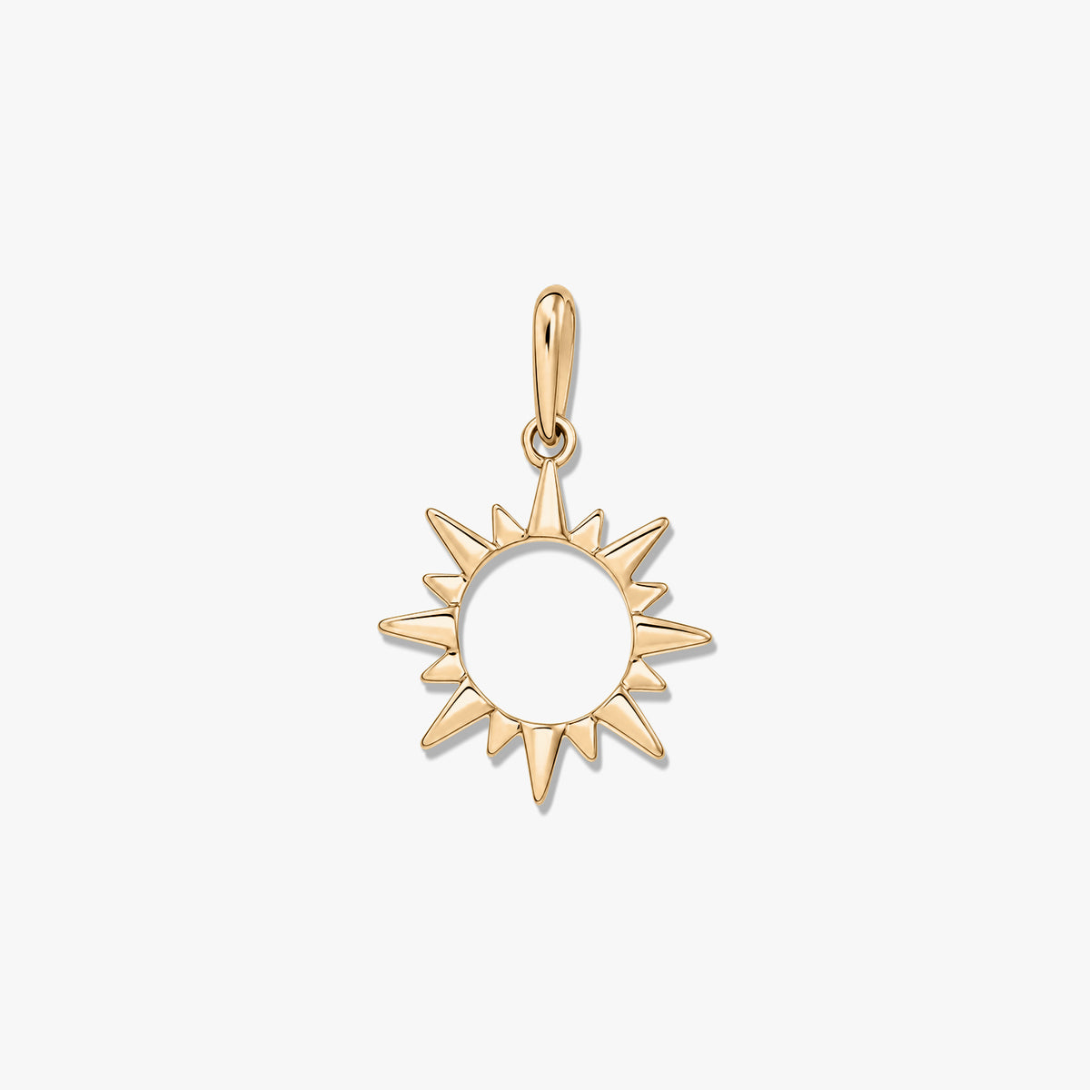 Polished yellow-gold sunburst pendant with an open center and bail, isolated on a white background.