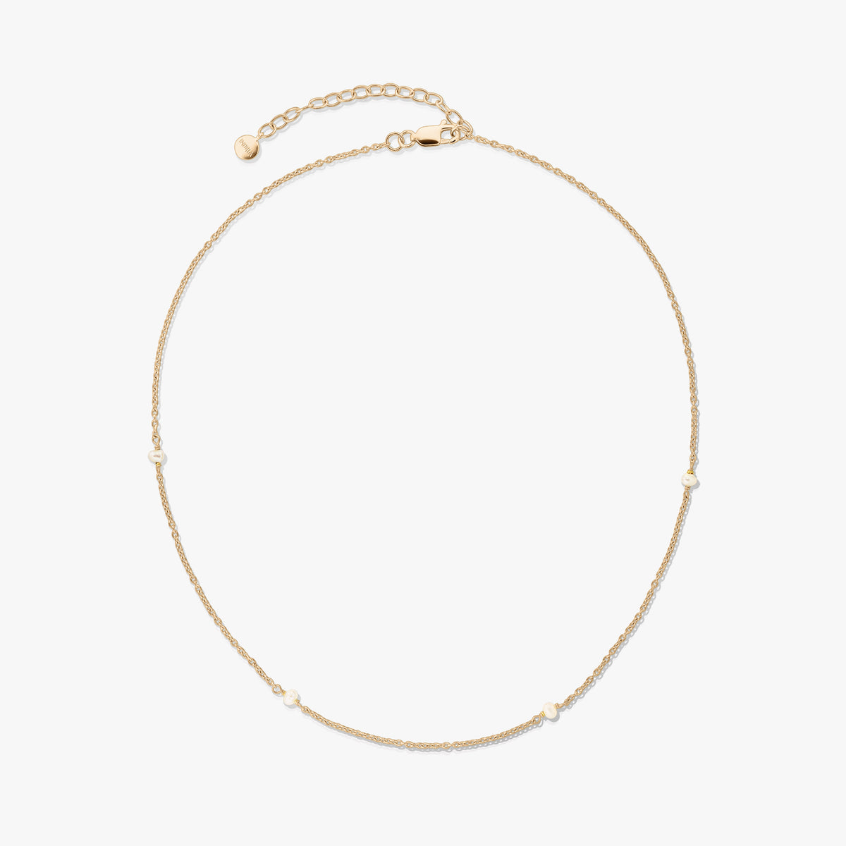 Delicate gold‑plated 925 silver necklace with tiny natural pearls and an adjustable extender with lobster clasp on a white background.