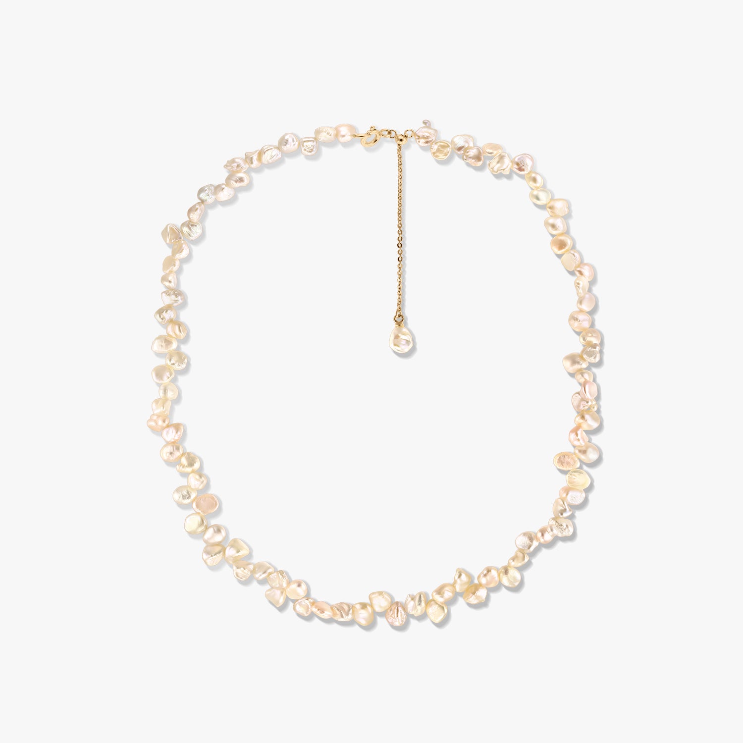 Gold‑plated silver necklace with irregular pink keshi pearls and an adjustable extender, photographed on a white background.