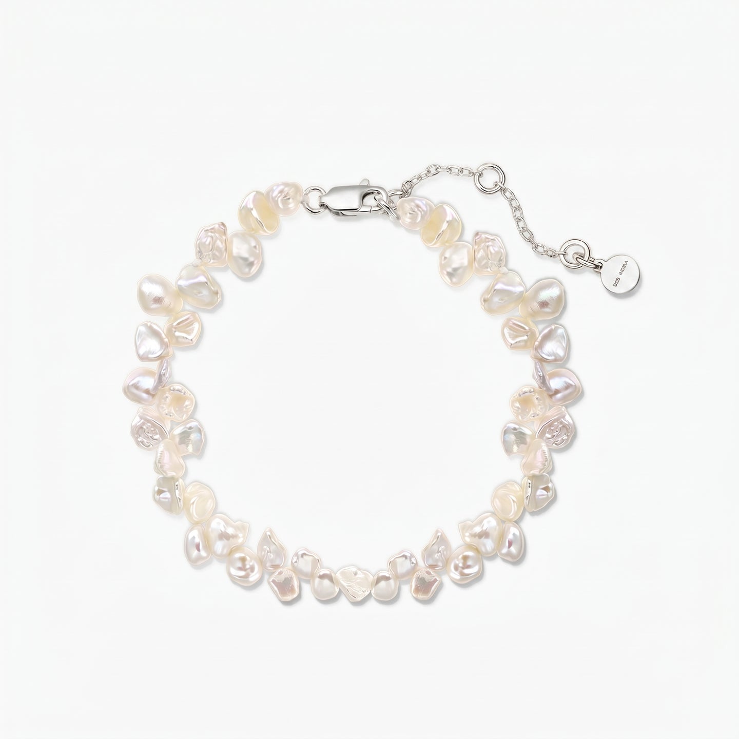 Adjustable keshi freshwater pearl bracelet with a rhodium‑plated 925 silver lobster clasp and extender chain on a white background.
