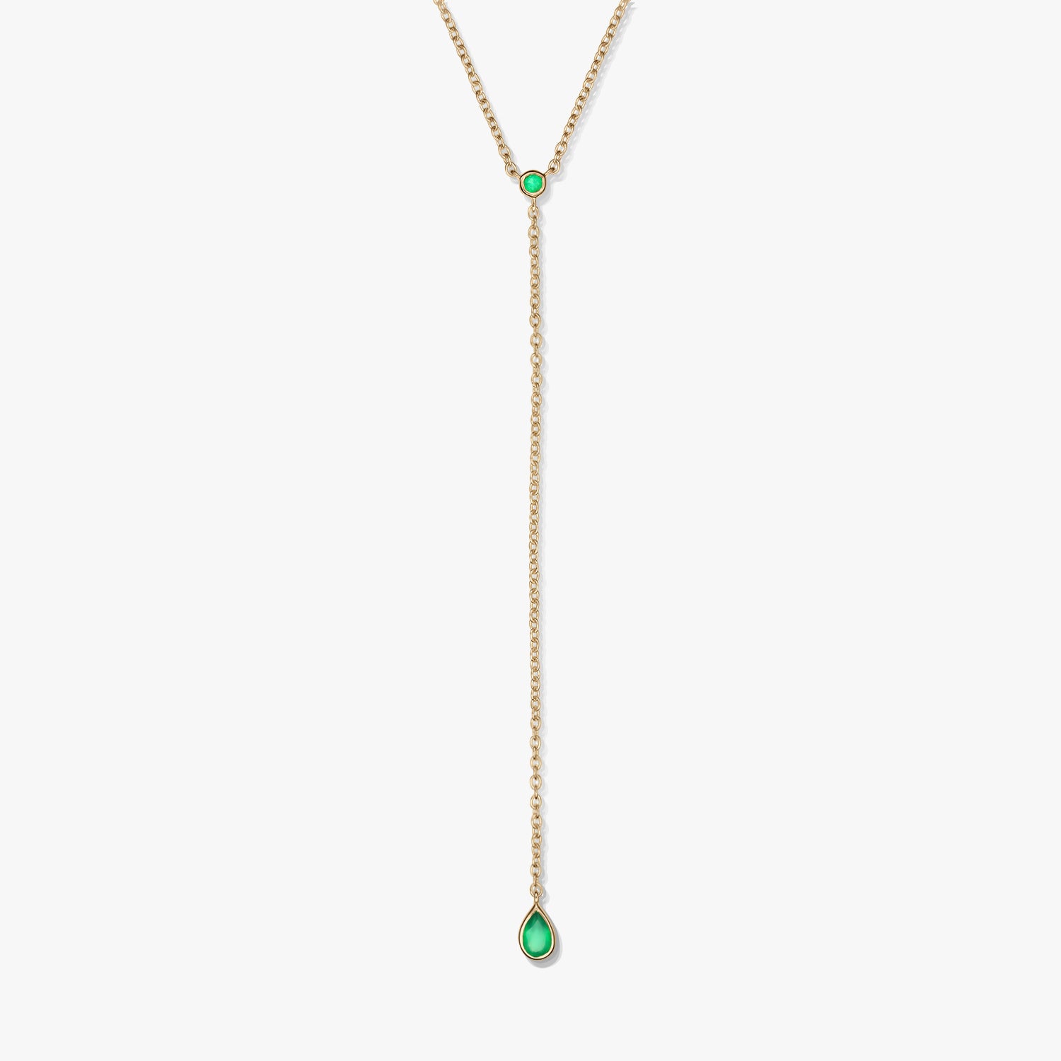 Gold-plated sterling silver lariat necklace with green onyx accents and a teardrop drop pendant, photographed on a white background.