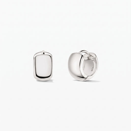 Bold Mini Hoops Silver Earrings in 925 sterling silver by Indira, shown on a white background with one earring front-facing and the other side view displaying the hinged clasp.