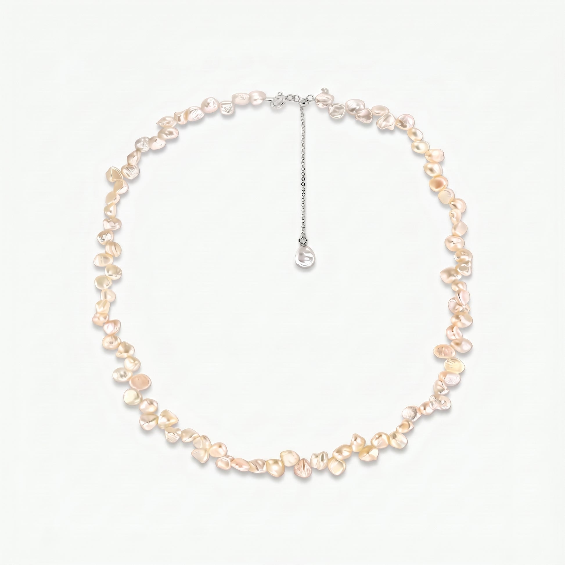 Brielle sterling silver necklace with pink keshi freshwater pearls and an adjustable extender chain on a white background.