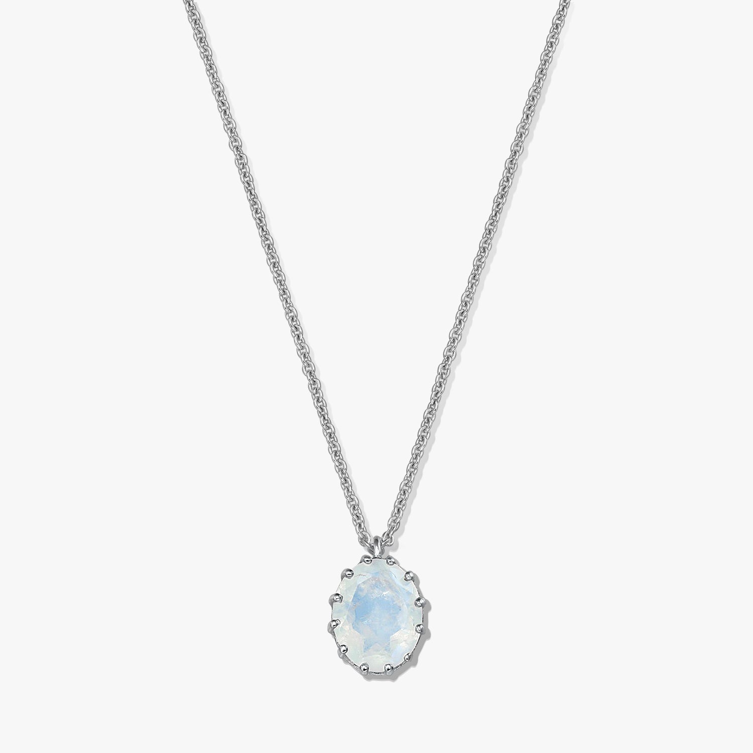 Sterling silver necklace with an oval moonstone pendant on a white background.