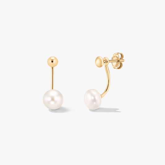 Pair of gold‑plated sterling silver ear jacket earrings with white natural pearls, shown on a clean white background.