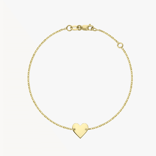 14K gold heart bracelet on a white background