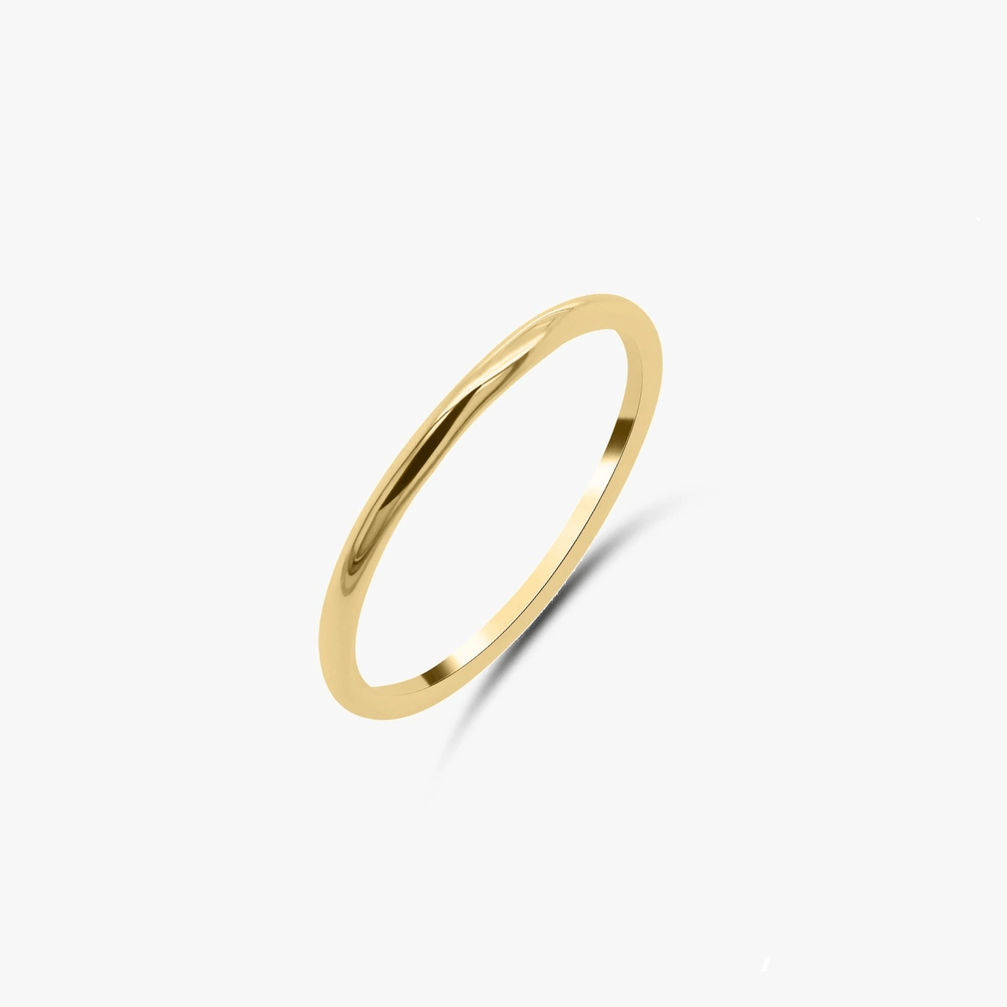 Minimalist gold-plated silver ring on a white background.